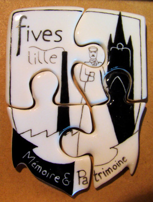Fève puzzle 4 parties personnalisé selon le logo et forme de l'association Mémoire et Patrimoine de Fives